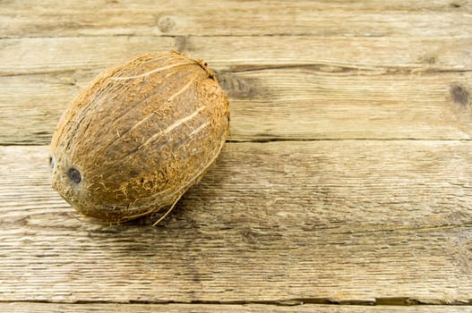 coconut and  lie on a wooden background.