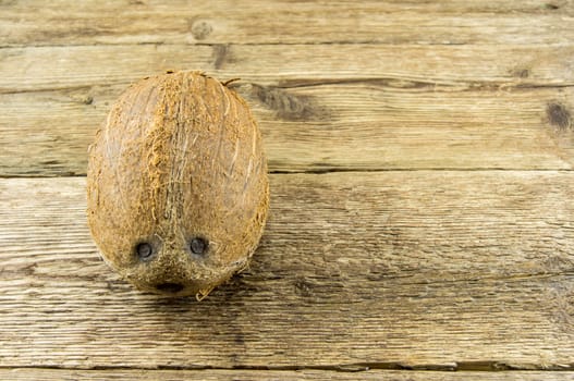 coconut and  lie on a wooden background.