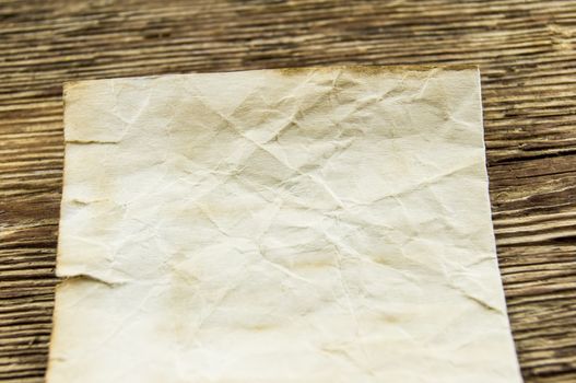 old paper  lie on a wooden background
