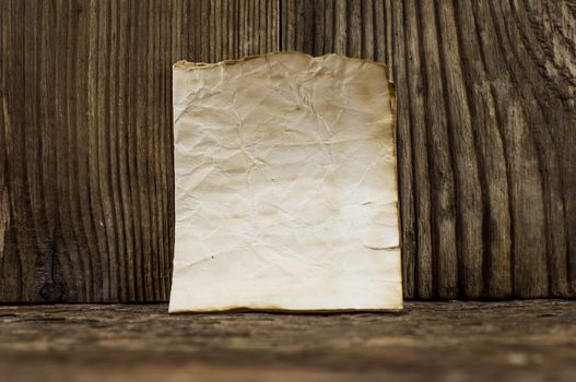 old paper  lie on a wooden background.