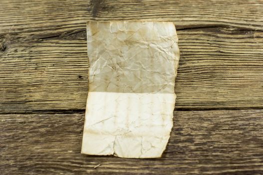 old paper  lie on a wooden background.