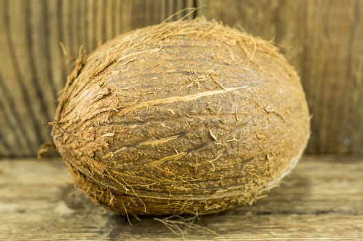 coconut and lie on a wooden background.