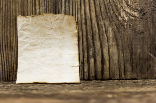 old paper  lie on a wooden background.