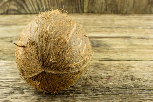 coconut and lie on a wooden background.