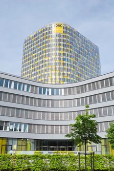 Munich, Germany - May 12, 2015: Vertical shot of 18-storey headquarters tower of ADAC European road traffic emergency medical and roadside technical accident assistance association.