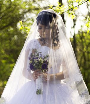 The bride is closed veil. For your commercial and editorial use.