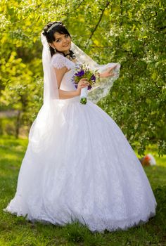 Beautiful bride posing in her wedding day. For your commercial and editorial use.