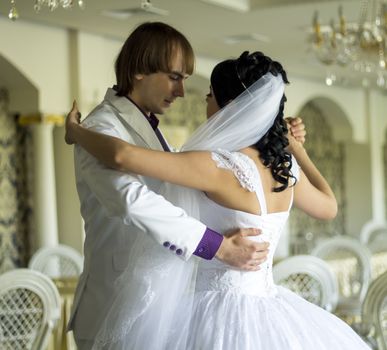 Bride and groom dancing the first dance at their wedding day. For your commercial and editorial use