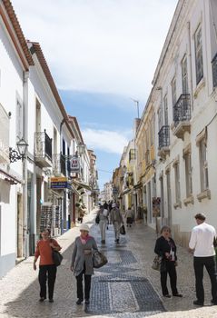 LAGOS,PORTUGAL-APRIL20, 2015: people shopping in the shopping street  in Lagos on April 19 2015,Lagos is the most southern big city of the Algarve Area in Portugal