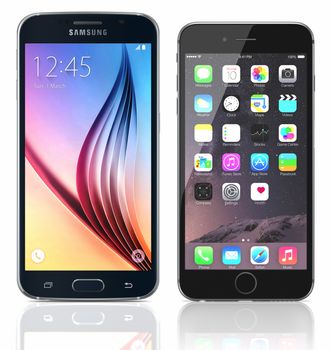 Galati, Romania - May 15, 2015: Black Sapphire Samsung Galaxy S6 and black Apple iPhone 6 on white background. The Samsung Galaxy S6 was launched at a press event in Barcelona on March 1 2015. Apple released the iPhone 6 and iPhone 6 Plus on September 9, 2014.