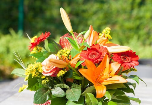 Colorful bouquet of flowers on the garden table
