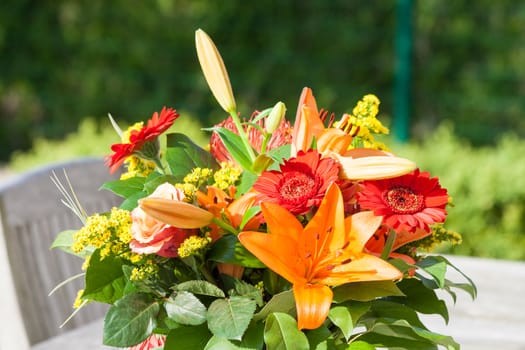 Colorful bouquet of flowers on the garden table