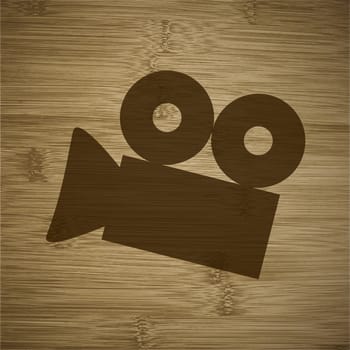 Cinema camera icon flat design with abstract background.