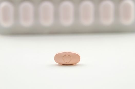 Pink tablet isolated on white background
