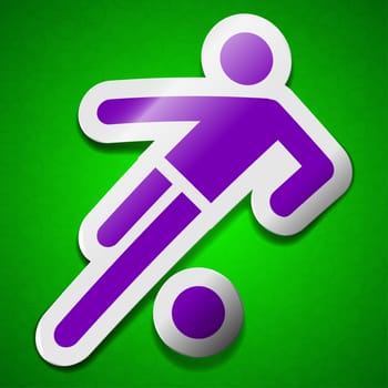 football player icon sign. Symbol chic colored sticky label on green background.  illustration