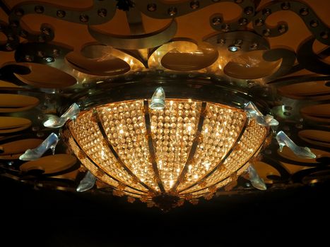 A light with glass slippers on the ceiling