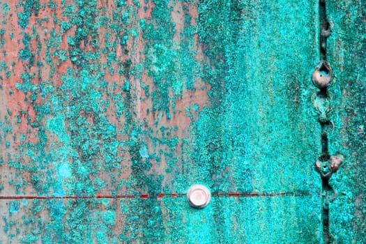 scratched and rusty green metal surface as background