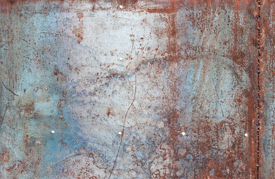 scratched and rusty orange metal surface as background