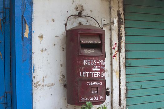 Traditional red old Indian mailbox. India Goa.