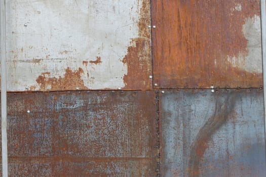 scratched and rusty orange metal surface as background