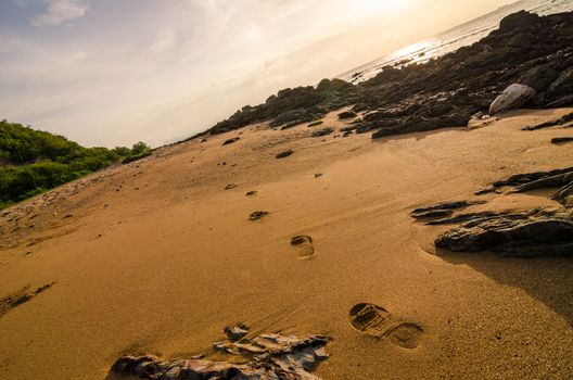 footprints and sea morning  light in Thailand