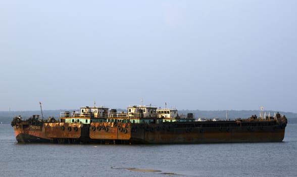 The parking of the old cargo ships stand. Cemetery of the old ships India, Goa.