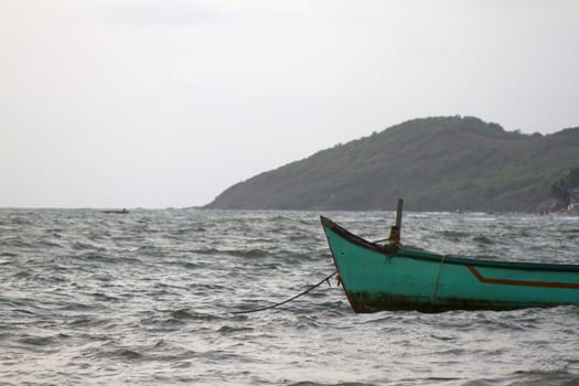 Old fishing boat at sea. India Goa.