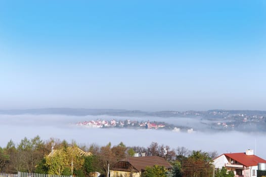 town in the morning fog