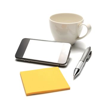 smart phone and coffee cup with sticky note and pen isolated on white background