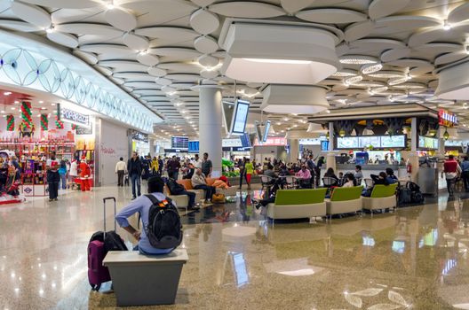 Mumbai, India - December25, 2014: Tourist Shopping at Duty free zone in Chhatrapati Shivaji International Airport - Terminal 2 on December25, 2014 in Mumbai, India. Skidmore, Owings and Merrill (SOM) was the architectural designer of the project. 