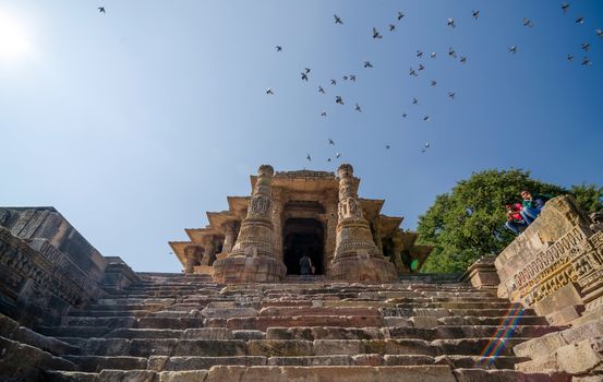 Ahmedabad, India - December 25, 2014: Indian people visit Sun Temple Modhera in Ahmedabad, India on December 25, 2014. It was built in 1026 AD by King Bhimdev of the Solanki dynasty.