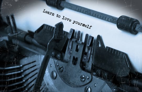 Close-up of an old typewriter with paper, selective focus, Learn to love yourself