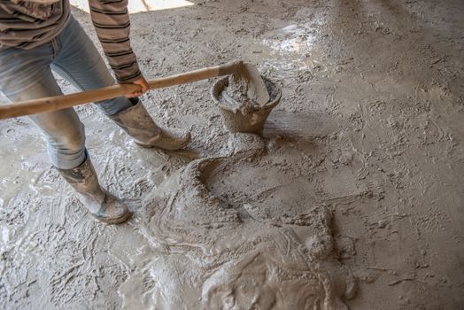 Worker is  mixing mortar prepare for plastering