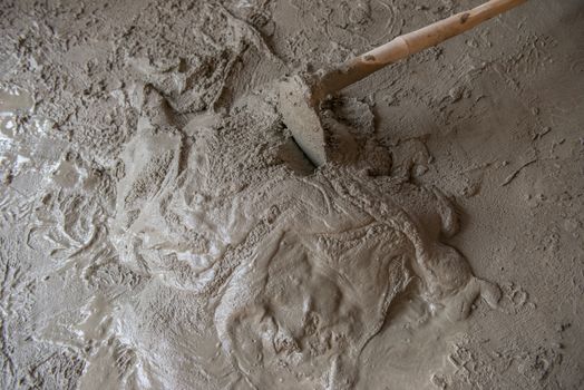 Worker is  mixing mortar prepare for plastering