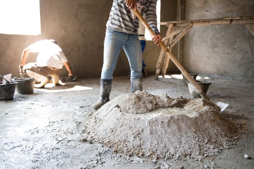 Worker is  mixing mortar prepare for plastering