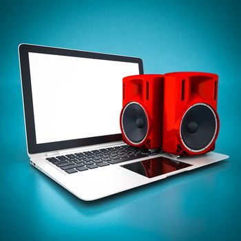 music speaker and white laptop on a blue background