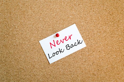 Sticky Note On Cork Board Background Never look back concept
