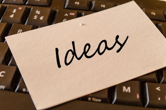 Ideas Concept on black keyboard