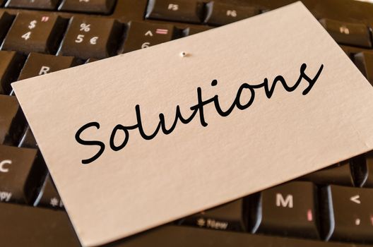 Solutions Concept on black keyboard