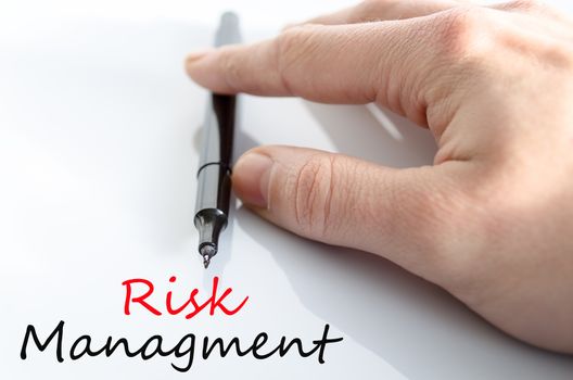 Pen in the hand isolated over white background Risk managment concept