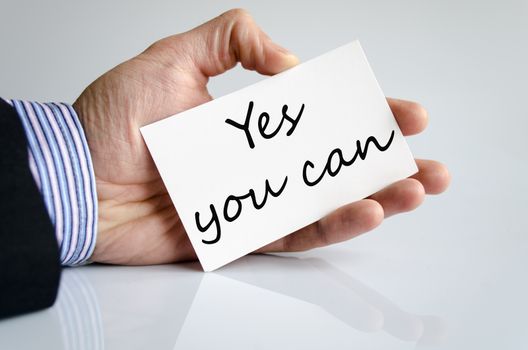 Business man hand writing Yes you can