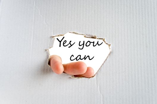 Hand and text on the cardboard background Yes you can Concept