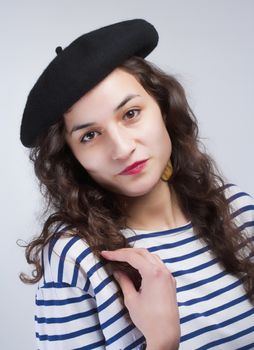 Young Beautiful Woman with French Style Beret and Striped T-Shirt
