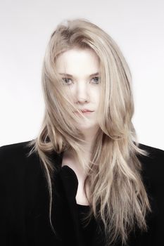 Portrait of a Young Woman with Blond Hair and Black Coat