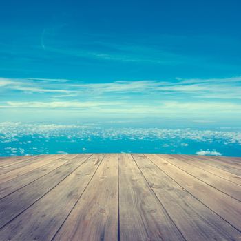 Mid air aerial view from wooden platform, sunrise with blue sky white cloud.