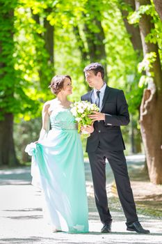 Bride and groom. Portrait of a loving wedding couple strolling in Tivoli park in Ljubljana, Slovenia.