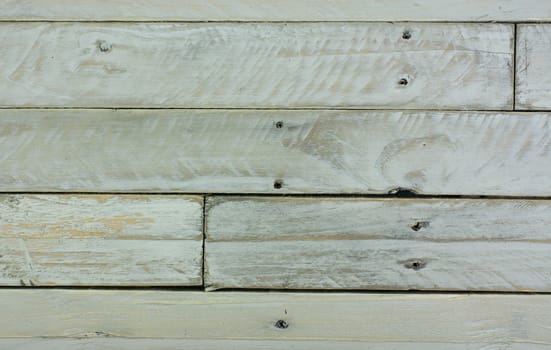 Old wooden planks painted white and distressed