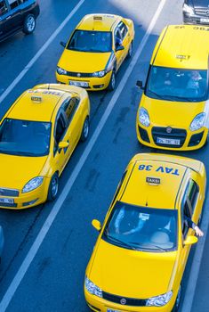 ISTANBUL - SEPTEMBER 21, 2014: Yellow taxis along city streets. housands of yellow taxis powered by clean-burning liquefied natural gas, throng Istanbul's streets