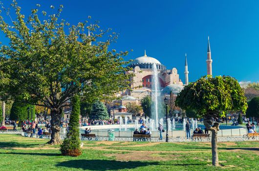 ISTANBUL - SEPTEMBER 22, 2014: Hagia Sophia Museum with tourists on a beautiful day. The landmark is the most visited in Istanbul.