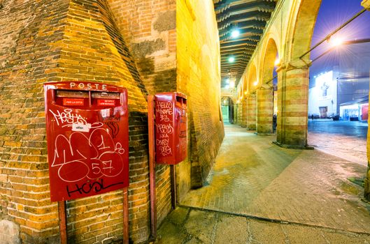 BOLOGNA - OCTOBER 21, 2014: Tourists in city center at night. Bologna is visited by more than 5 million people annually.